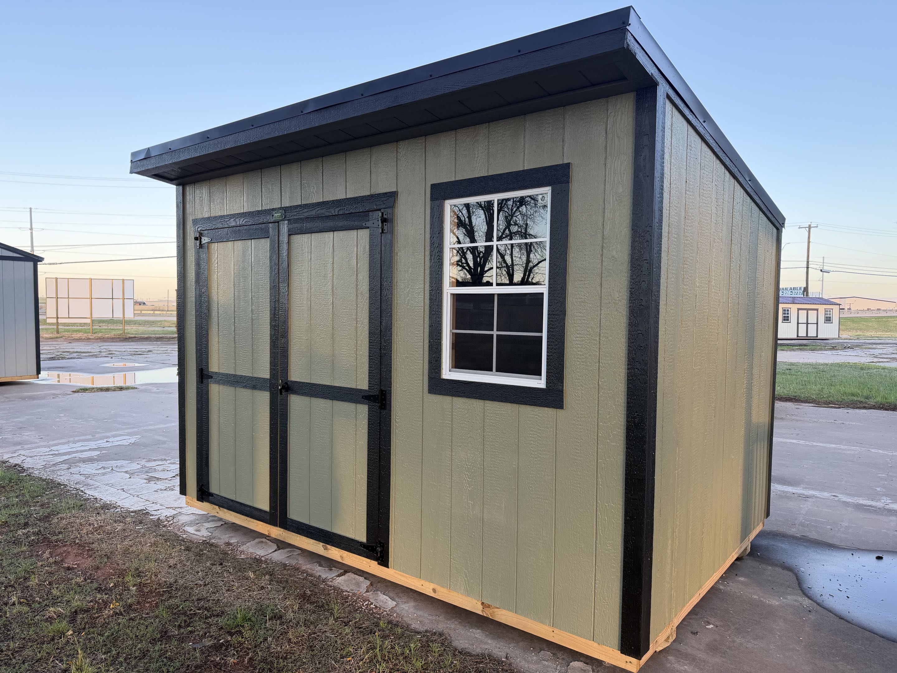 8x12 cottage shed, olive green LP SmartSide with black trim and single-slope roof